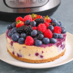 Instant Pot Berry Cheesecake topped with fresh berries